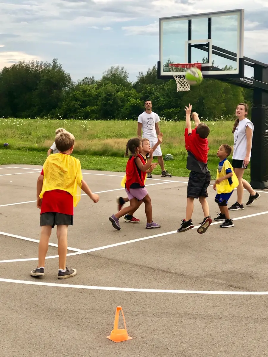 A young player shooting during Oasis Basketball Camp