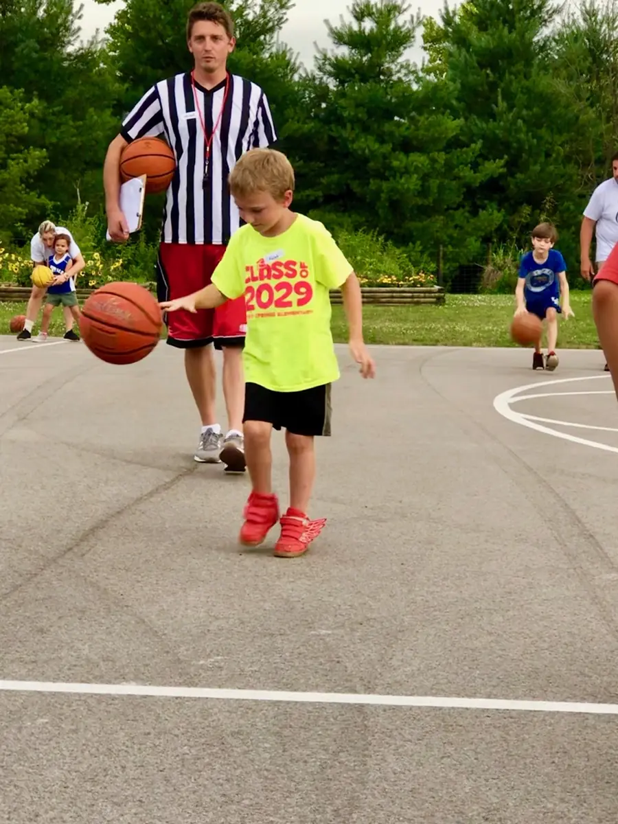 Players running drills at Oasis Basketball Camp